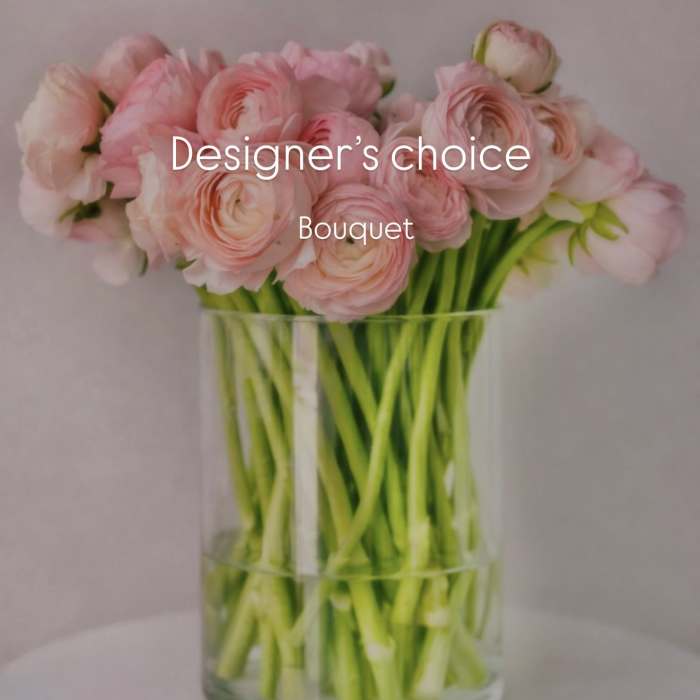 Pink ranunculus bouquet in a clear glass vase