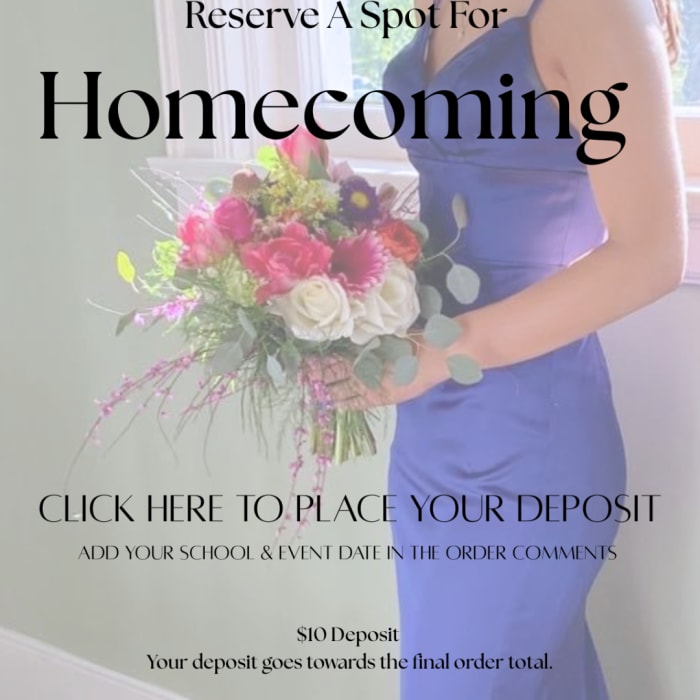 Woman holding a colorful bouquet with roses and daisies