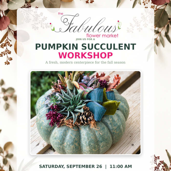 Pumpkin centerpiece topped with succulents and ribbon accents