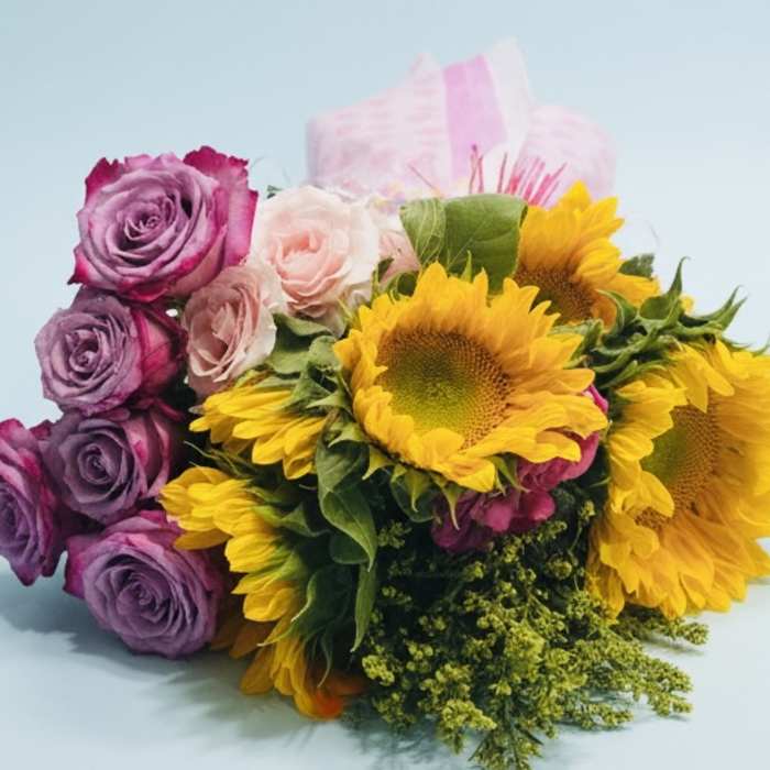 Bouquet of purple roses, pale pink roses, and yellow sunflowers