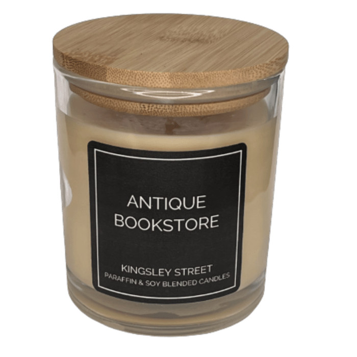 Scented candle in a glass jar with a wooden lid and black label