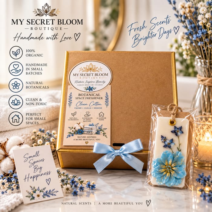 Gift box with a floral candle and space freshener, surrounded by blue and white flowers