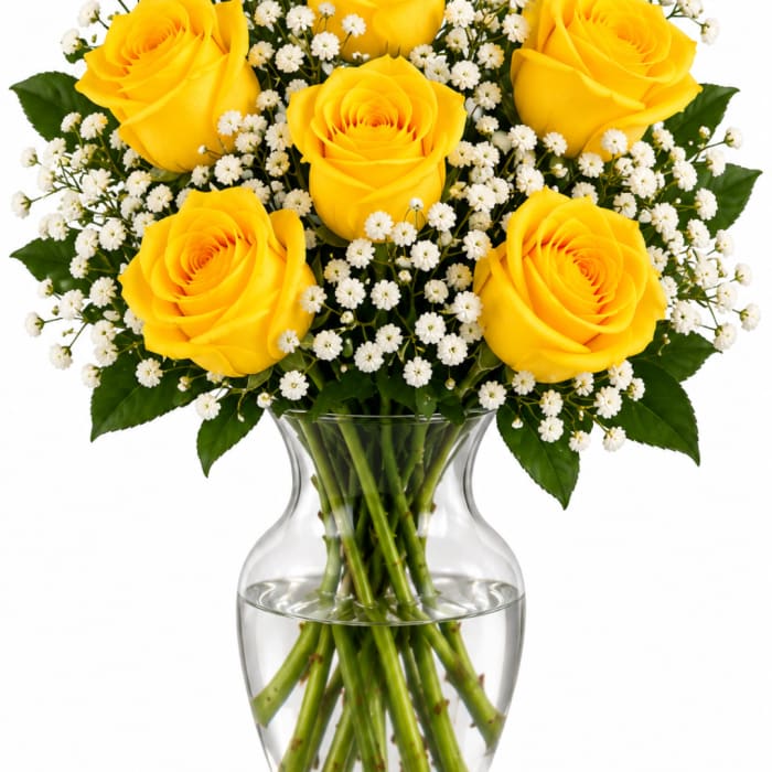 Yellow roses with white baby's breath in a clear glass vase