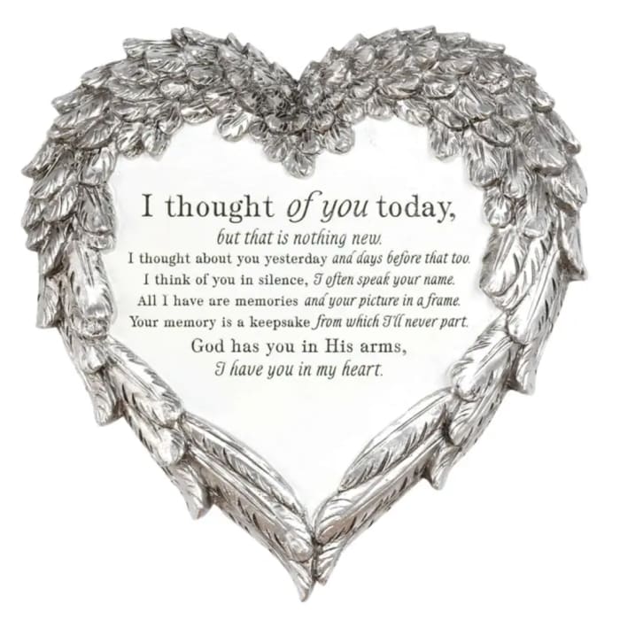 Heart-shaped silver memorial plaque with a condolence message