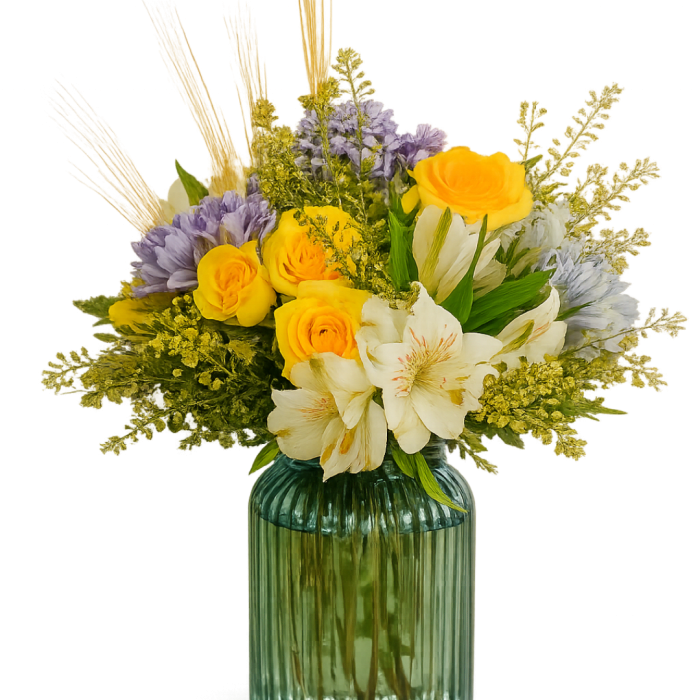 Yellow and white flowers in a ribbed glass vase
