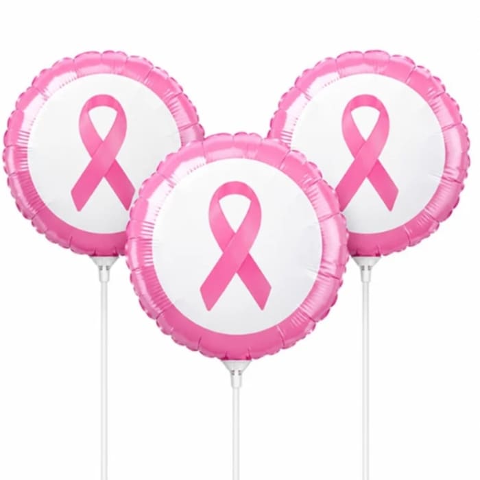 Three pink ribbon balloons on sticks against a white background