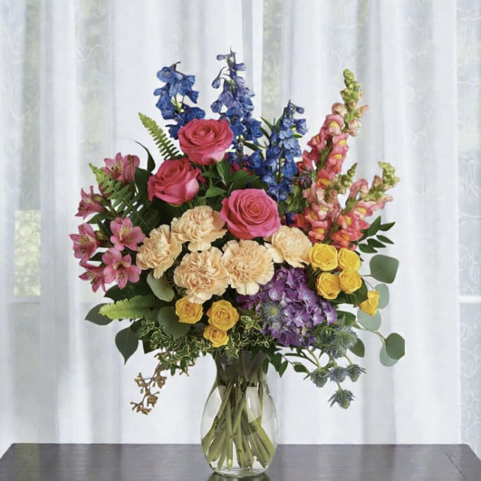 Colorful mixed bouquet in a clear glass vase