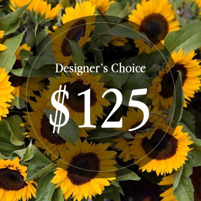 Cluster of bright yellow sunflowers with dark centers and overlaid text reading Designer's Choice $125.