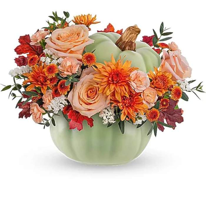 Pumpkin-shaped vase with peach and orange flowers