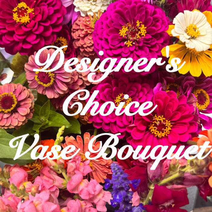Mixed bouquet of bright zinnias and snapdragons with bold pink and yellow blooms