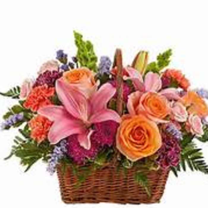 Basket of pink lilies, orange roses, and mixed flowers