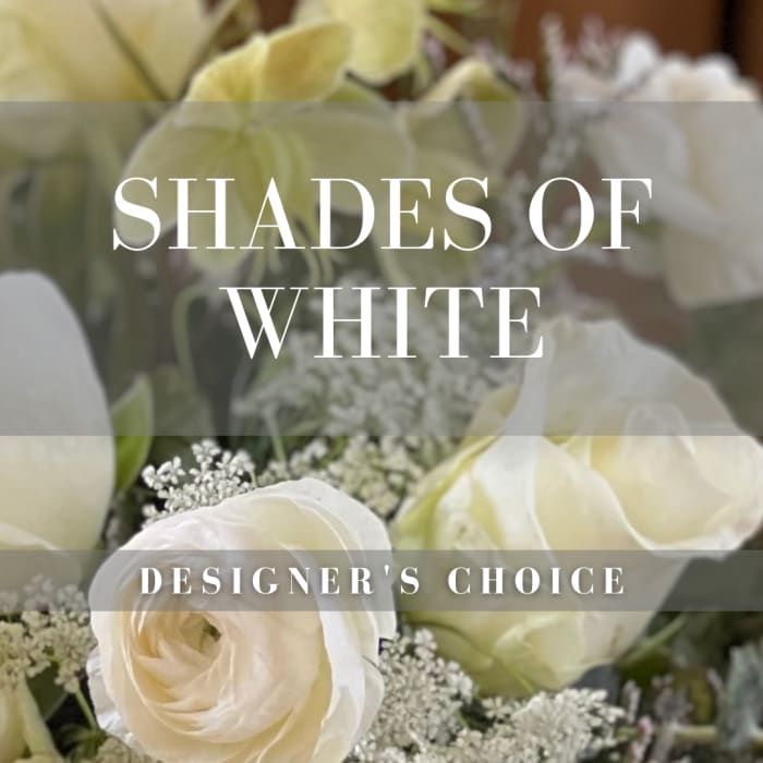 White roses and small white filler flowers with overlaid text