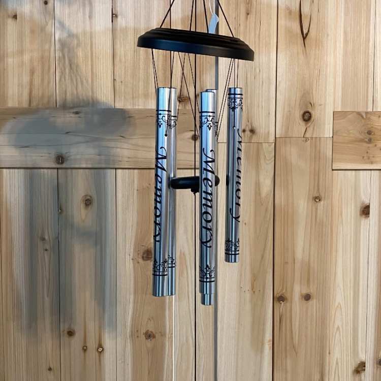 Silver memorial wind chime with engraved tubes and a hanging plaque