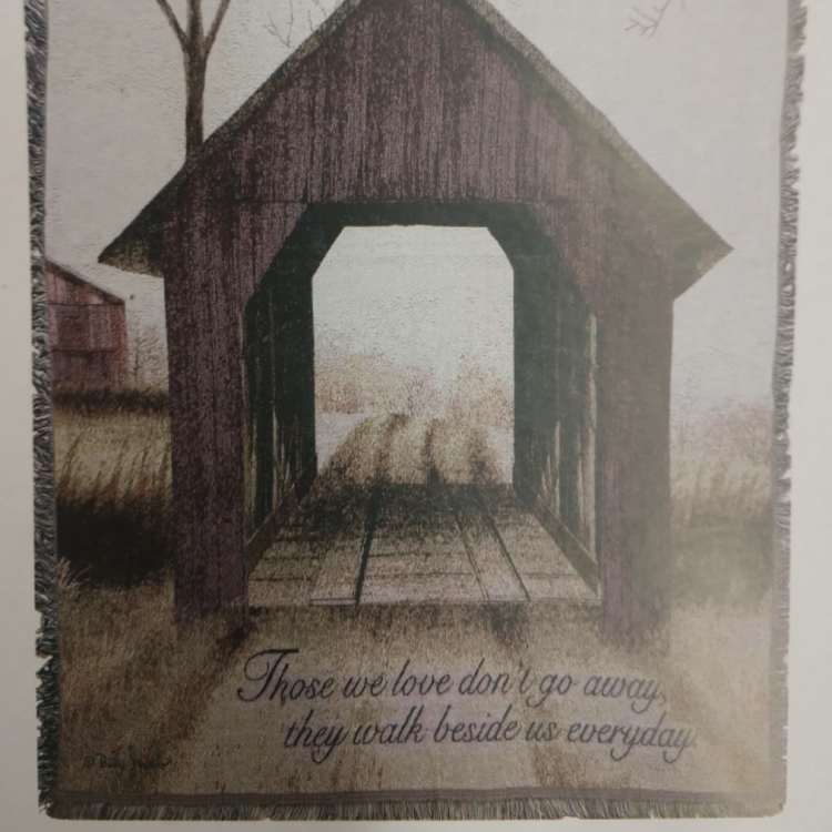 Framed memorial wall hanging with a covered bridge and sympathy quote