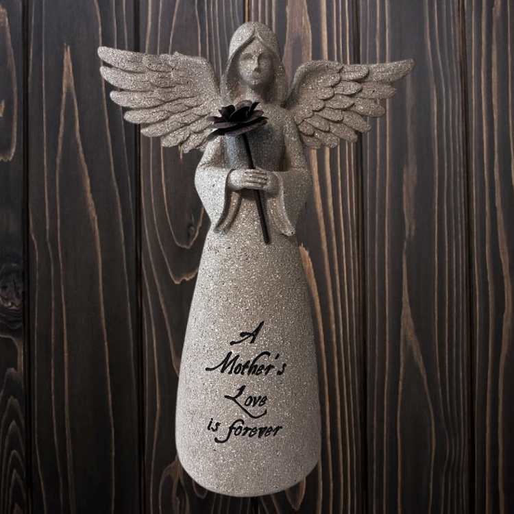 Glittery angel figurine holding a black flower with "A Mother's Love is forever" text