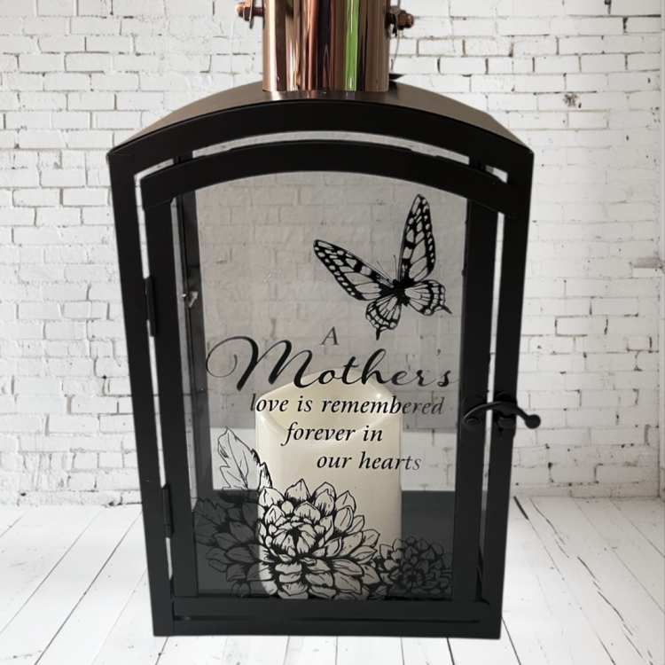 Black lantern with a candle and a Mother's Day memorial message