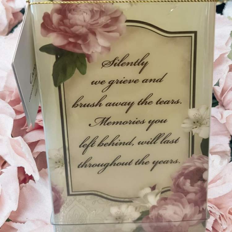 Sympathy card with pink floral border and a memorial message