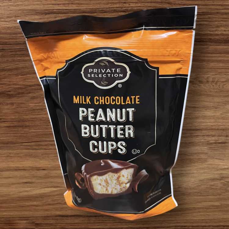 Bag of milk chocolate peanut butter cups on a wooden surface