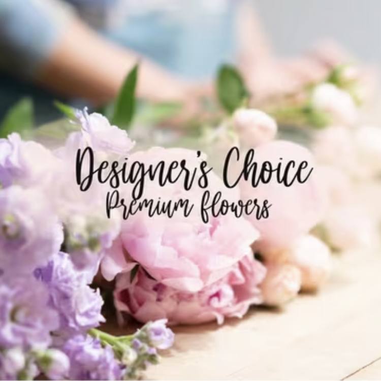 Pastel pink and lavender flowers arranged around text reading "Designer’s Choice Premium flowers"