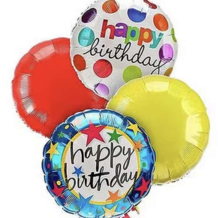 Cluster of colorful birthday balloons with two printed message balloons