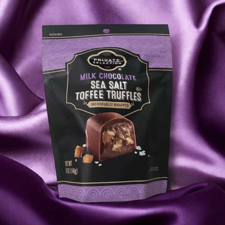 Bag of milk chocolate sea salt toffee truffles on purple satin