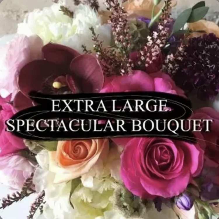 Large bouquet of pink, white, and peach flowers
