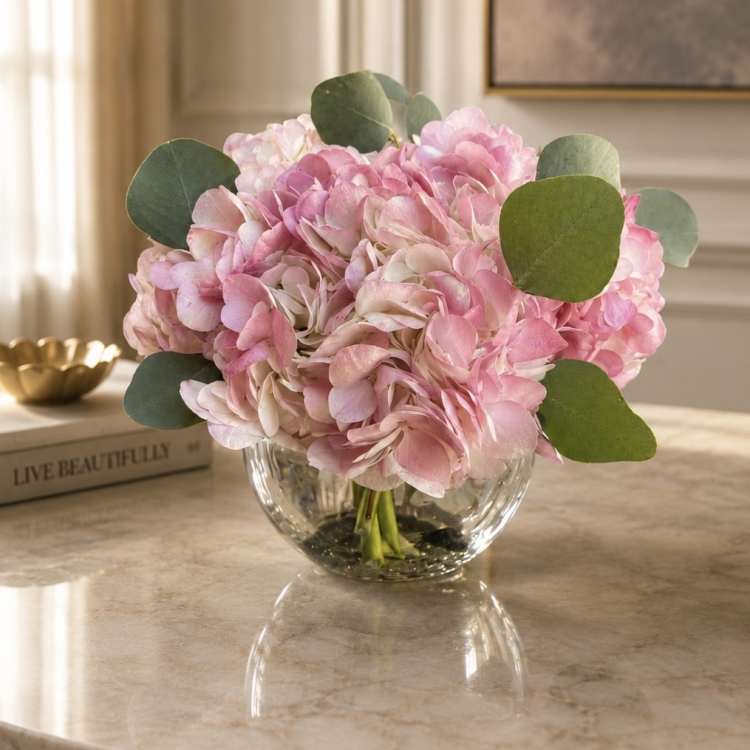 Pink hydrangea bouquet in a clear glass vase