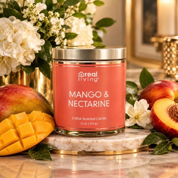 Mango and nectarine scented candle in a metal tin with fruit and white flowers