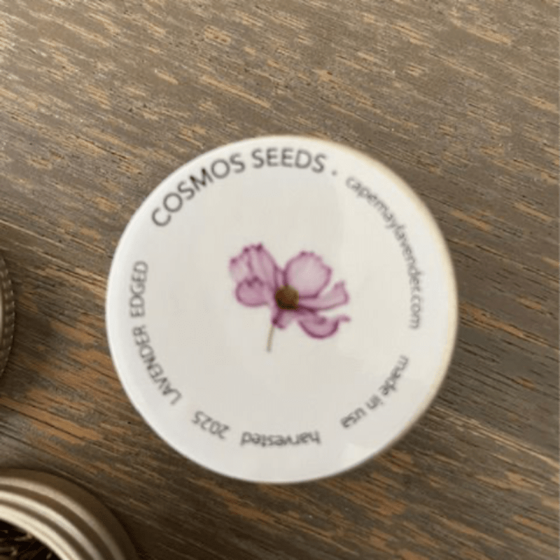 Round seed packet lid with a pink flower illustration