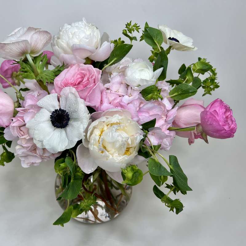 Pink and white mixed bouquet in a clear glass vase