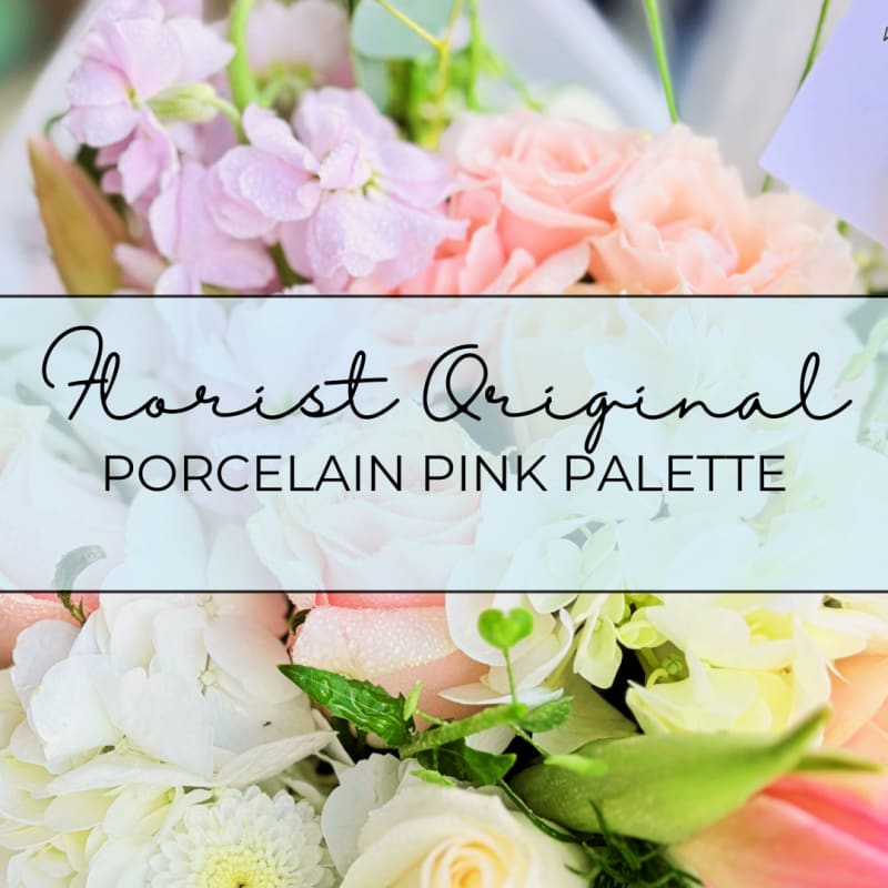 Pink and white floral arrangement with roses and hydrangeas