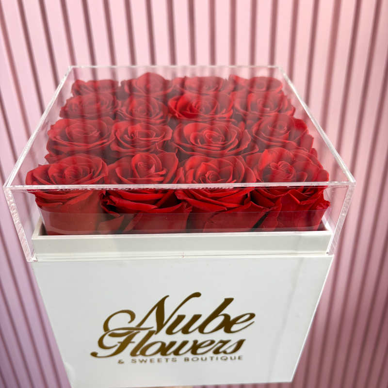 Box of red roses in a clear acrylic lid box