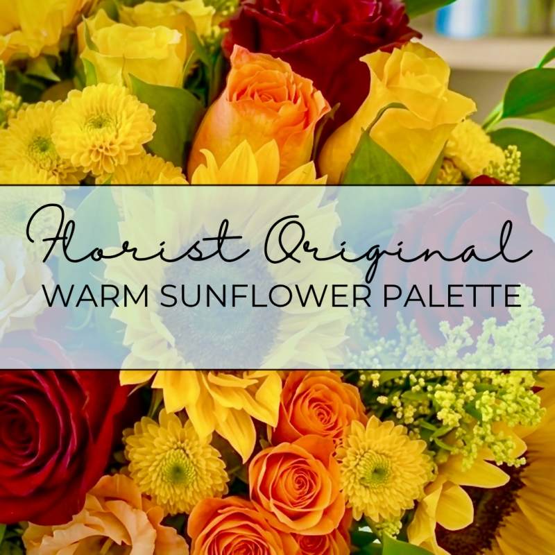 Mixed bouquet of red, orange, and yellow flowers with a text banner across the center