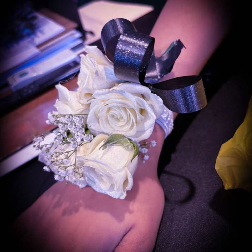 White rose wrist corsage with black ribbon