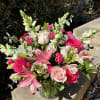 Bouquet of pink and white flowers in a glass vase