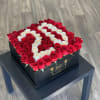 Square box of red and white roses arranged in a heart pattern