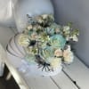 Pastel rose bouquet in a white hat box