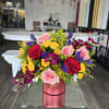A bold, joy-filled arrangement designed to stand out. This floral box brings