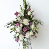 Tall floral standing spray with white and lavender roses and white mums