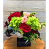 Slick cube vase arrangement made with hydrangea, roses, daisies and mini callas.