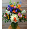 Lush full vase bouquet of lilies, hydrangea, roses, iris and delphiniums.