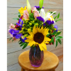 Brighten their day with this vibrant arrangement of bright sunflowers and blue