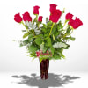 Red roses arranged in a tall burgundy vase