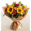 Bouquet of sunflowers, roses, and carnations wrapped in brown paper