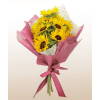 Bouquet of yellow sunflowers wrapped in pink paper with a ribbon