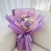 A dreamlike preserved flower bouquet featuring 3 premium lavender-purple roses and 3