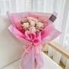  A sweet and enchanting preserved flower bouquet featuring premium soft peach-pink