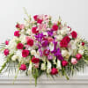 A grand and comforting horizontal casket spray designed to beautifully honor a
