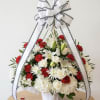 Basket arrangement for funeral, mix of white &amp;red flowers in white basket