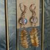 Pair of dangling crystal earrings with copper wire coils